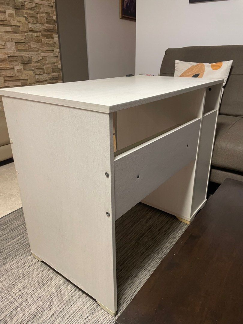 IKEA Study Table (Category: Tables & Sets) located in Singapore. Submitted by slowwwbro (Listing ID 1324510696, Image 3). Description: Ikea White Table with Built in Shelf Fast Deal Some scratch marks but not very noticeable. Good quality, sturdy design .
