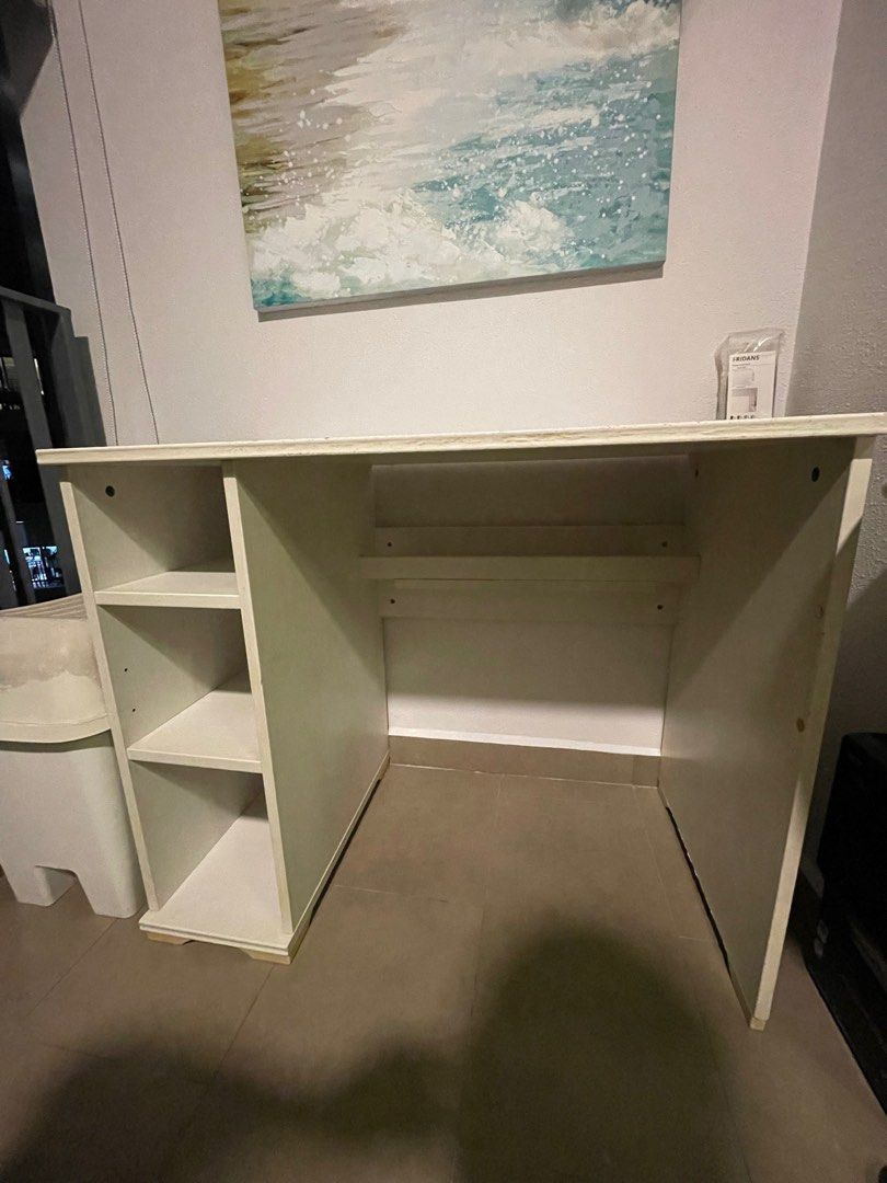 IKEA Study Table (Category: Tables & Sets) located in Singapore. Submitted by slowwwbro (Listing ID 1324510696, Image 2). Description: Ikea White Table with Built in Shelf Fast Deal Some scratch marks but not very noticeable. Good quality, sturdy design .