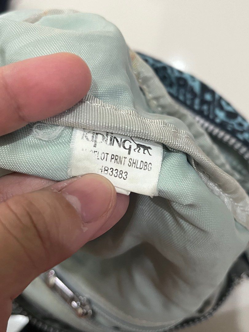 Kipling Bag (Category: Cross-body Bags) located in Mandaluyong City. Submitted by 4everhappee (Listing ID 1324431863, Image 2). Description: Kipling Lancelot crossbody bag Flaw: With pen marks inside, hardware 90% smooth, no monkey.