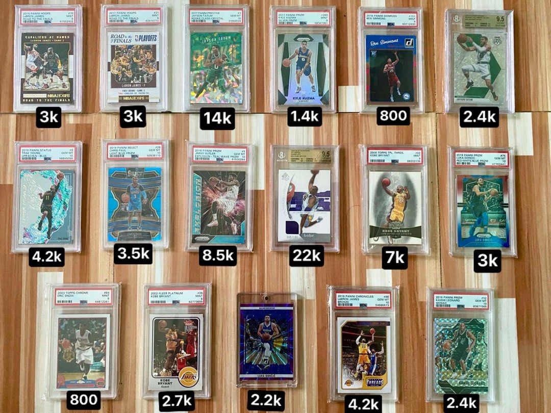 NBA GRADED CARDS (Category: Graded Singles) located in General Trias. Submitted by eddd14 (Listing ID 1324394803, Image 1). Description: -2019 PANINI SELECT CHRIS PAUL LIGHT BLUE PRIZM PSA 10 (POP 5) /299 - 3,500 -2015 PANINI HOOPS LEBRON JAMES ROAD TO THE FINALS PSA 9 (POP 1) /499 - 3,000 -2017 PANINI HOOPS LEBRON JAMES ROAD TO THE FINALS PSA 9 (POP 12) /2017 - 3,000 -2002 FLEER PLATINUM KOBE BRYANT PSA 9 - 2,700 -2019 PANINI STATUS TRAE YOUNG U
