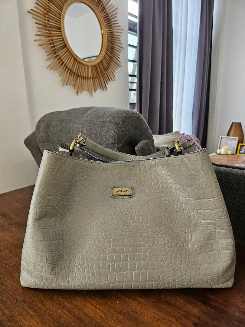 Tannery Manila Anita Tote (Category: Luxury Bags & Wallets) located in Quezon City. Submitted by theclosetoptimist (Listing ID 1324380765, Image 2). Description: SRP around P11k Roomy, versatile, genuine leather bag. Comes with dustbag, leather tag, 2 straps (long to wear crossbody and a shorter one to wear as a top handle / tote). This would make for a great diaper / mommy bag. Exterior clean with barely visible corner scuff marks. Interior need