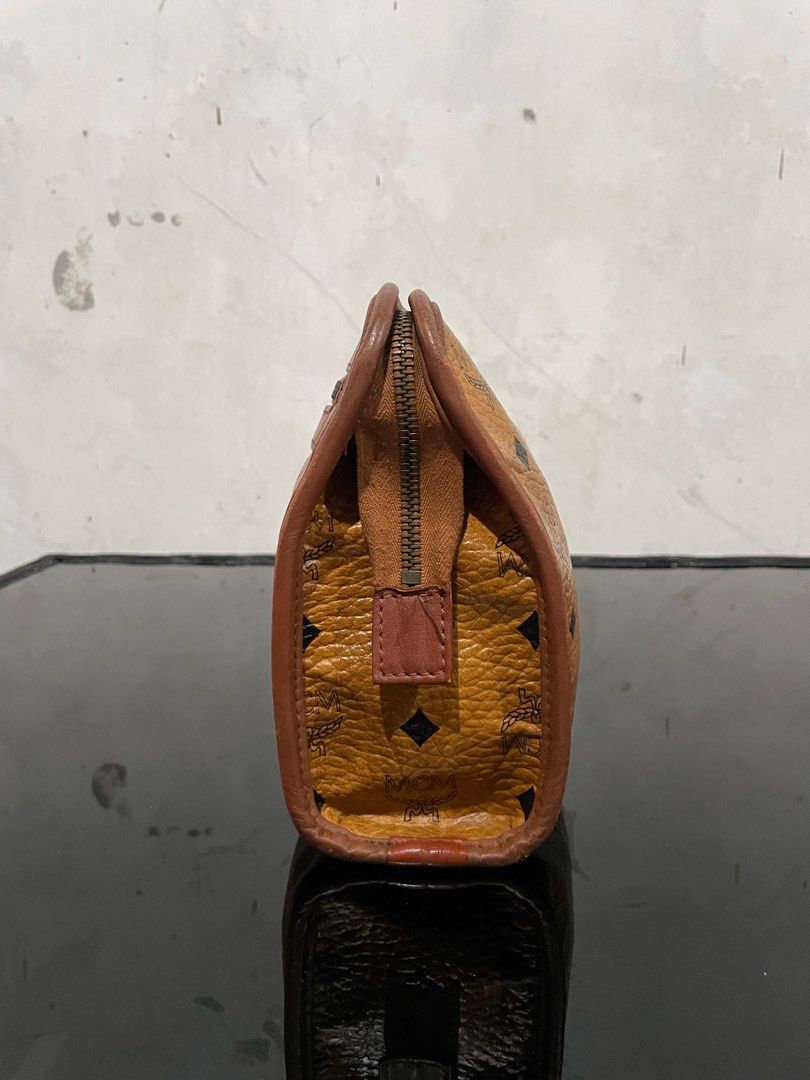 Vintage Mcm Visetos Clutch Bag (Category: Luxury Bags & Wallets) located in Quezon City. Submitted by Prive_Online (Listing ID 1324410837, Image 2). Description: WTS! - -Vintage Mcm Visetos Clutch Bag -Guaranteed Authentic -Size: Medium -Dimensions: H 7.5in x L 11.5in x W 3in -Signs of use -Excellent condition outside of the bag -Riri Zipper - Issues: Main Pocket Crack Leathers and tag is pealed off, Second pocket minor Leather cracks above the t