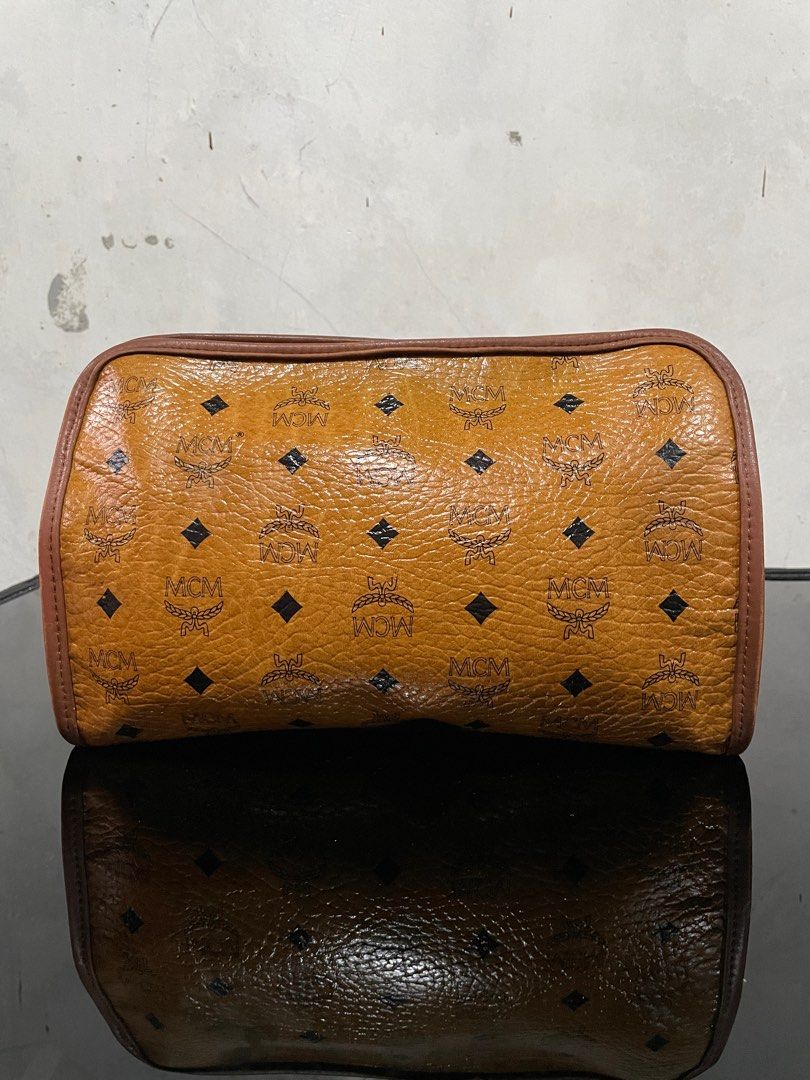Vintage Mcm Visetos Clutch Bag (Category: Luxury Bags & Wallets) located in Quezon City. Submitted by Prive_Online (Listing ID 1324410837, Image 3). Description: WTS! - -Vintage Mcm Visetos Clutch Bag -Guaranteed Authentic -Size: Medium -Dimensions: H 7.5in x L 11.5in x W 3in -Signs of use -Excellent condition outside of the bag -Riri Zipper - Issues: Main Pocket Crack Leathers and tag is pealed off, Second pocket minor Leather cracks above the t