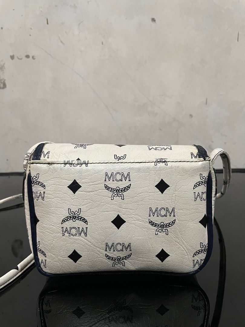 Vintage Mcm White Small Sling bag (Category: Cross-body Bags) located in Quezon City. Submitted by Prive_Online (Listing ID 1324410401, Image 2). Description: WTS! - Vintage Mcm White Small Sling bag -Guaranteed Authentic -Small bag fits small wallet -signs of use -fixed length of the strap -Needs Bags spa Minor issues: Color transfer - 4,500 + Shipping - Loc:Fairview Dm.