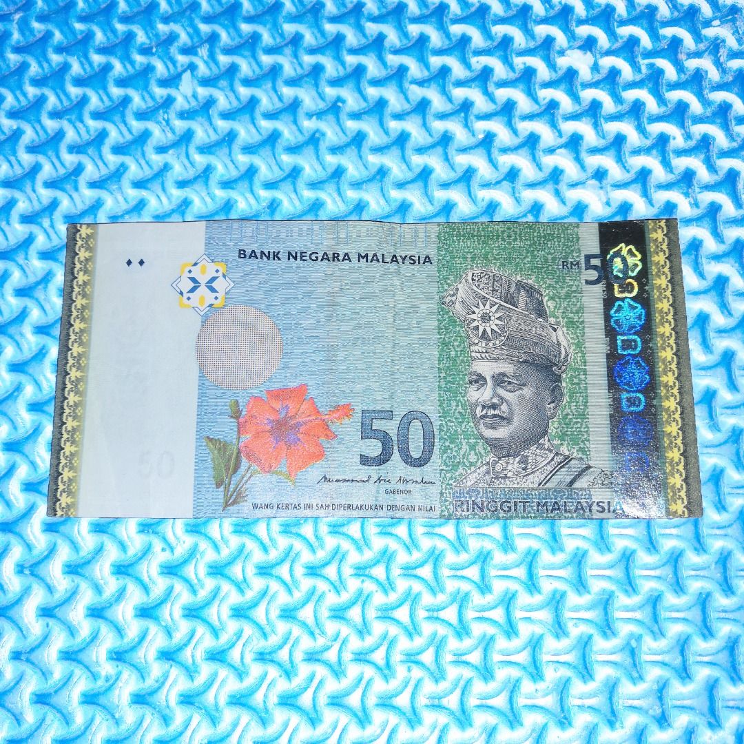 🆒 RM50 Misalignment Error / Printing Error Note (Category: Currency) located in Kuala Lumpur. Submitted by ashrough79 (Listing ID 1324635530, Image 1). Description: 🔴 Please Note: Price stated EXCLUDE postage 🚚 🔴 Kindly expect IMPERFECTIONS. NOT FOR FUSSY BUYER! Currency: 50 Ringgit / RM50 Type of Error: Misalignment Error / Cutting Misalignment S/N: NX1828605 Sign: Muhammad Ali Ibrahim / MBI Condition: No tear & no hole but have minor folds 