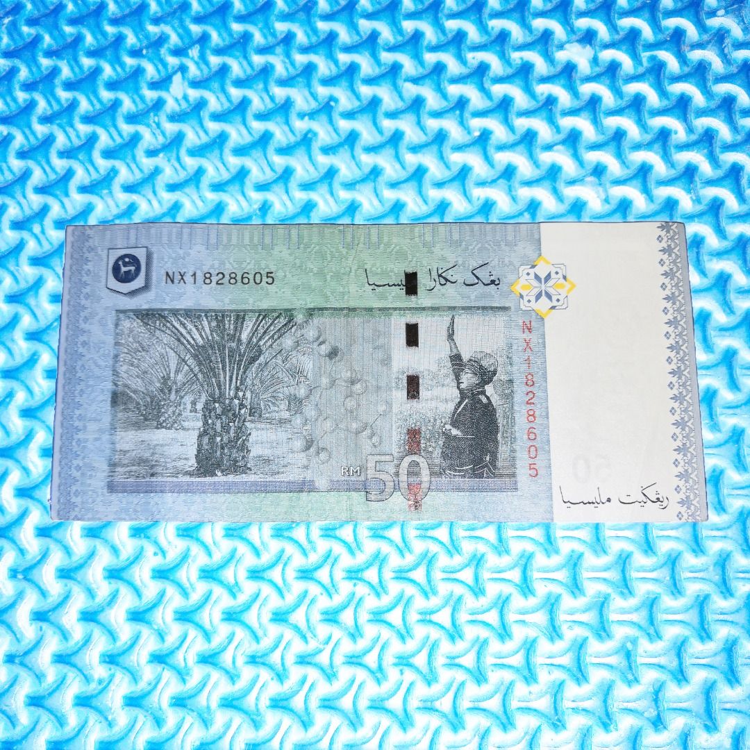 🆒 RM50 Misalignment Error / Printing Error Note (Category: Currency) located in Kuala Lumpur. Submitted by ashrough79 (Listing ID 1324635530, Image 2). Description: 🔴 Please Note: Price stated EXCLUDE postage 🚚 🔴 Kindly expect IMPERFECTIONS. NOT FOR FUSSY BUYER! Currency: 50 Ringgit / RM50 Type of Error: Misalignment Error / Cutting Misalignment S/N: NX1828605 Sign: Muhammad Ali Ibrahim / MBI Condition: No tear & no hole but have minor folds 