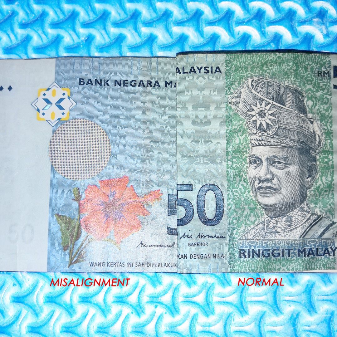 🆒 RM50 Misalignment Error / Printing Error Note (Category: Currency) located in Kuala Lumpur. Submitted by ashrough79 (Listing ID 1324635530, Image 3). Description: 🔴 Please Note: Price stated EXCLUDE postage 🚚 🔴 Kindly expect IMPERFECTIONS. NOT FOR FUSSY BUYER! Currency: 50 Ringgit / RM50 Type of Error: Misalignment Error / Cutting Misalignment S/N: NX1828605 Sign: Muhammad Ali Ibrahim / MBI Condition: No tear & no hole but have minor folds 