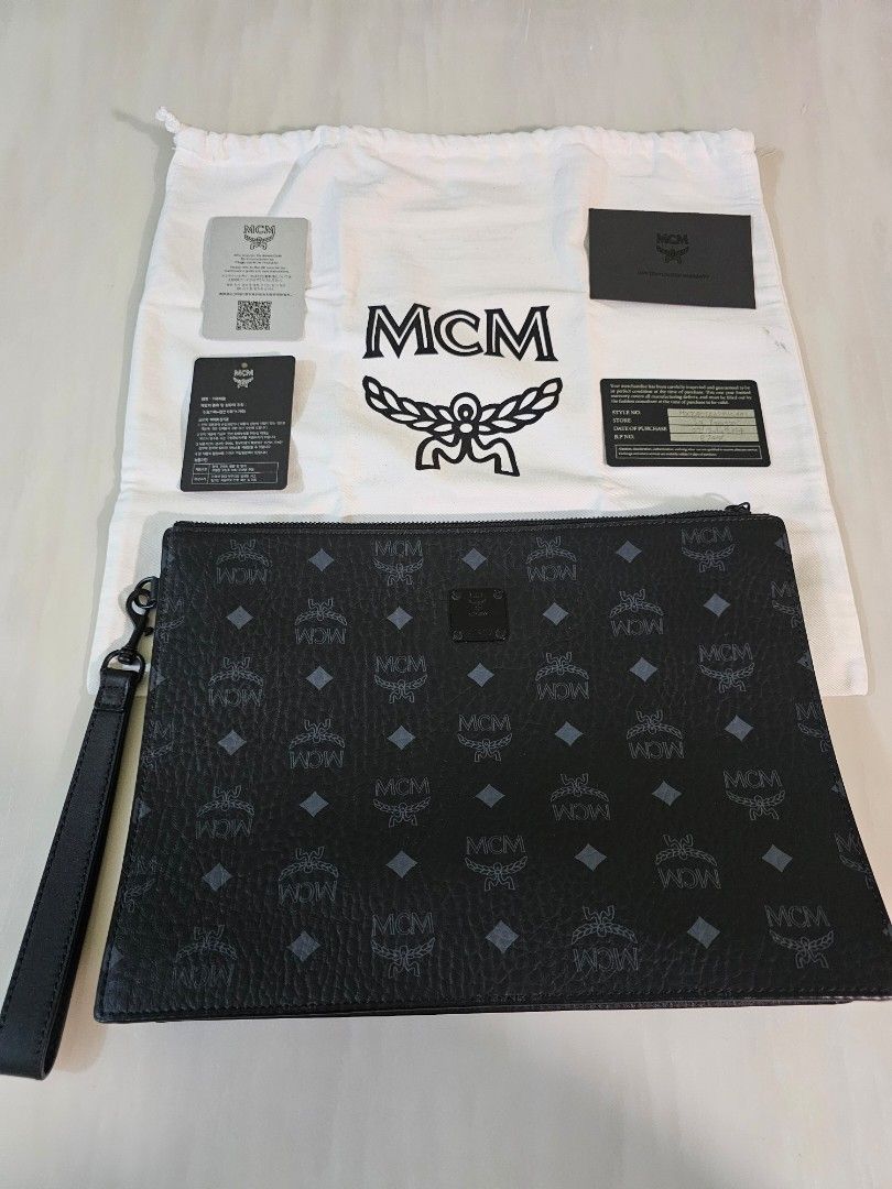AREN WRISTLET ZIP POUCH IN VISETOS (Category: Bags & Wallets) located in Singapore. Submitted by gordon.lim (Listing ID 1324698808, Image 2). Description: **(Warranty valid till 01 July 2025)** Bought $700++ from SG Paragon (Open for negotiation) The consummate clutch, this medium-sized zip pouch stands as a pillar of maximalist form and real-world function. Signature Visetos and nappa leather comprise the accessory, which features a detachable l