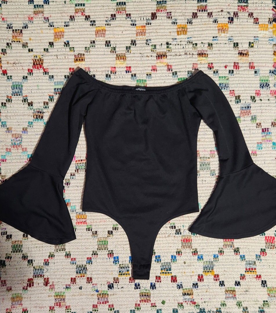 Black bell sleeved off shoulder bodysuit (Category: Others Tops) located in Makati City. Submitted by beabbbea (Listing ID 1324585411, Image 1). Description: brand is pretty little thing fits xs to s shipping via lalamove/grab or lbc.