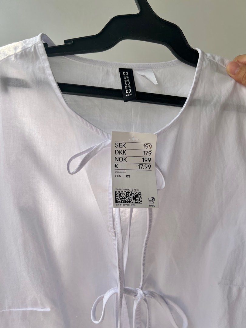 H&M Tie Tops (White and Black) (Category: Blouses) located in Tarlac. Submitted by lilipup (Listing ID 1324581499, Image 2). Description: brand new with tags 650 php each + shipping fee last price posted! size XS (fits XS-S) available in white and black got them from H&M online app popular GANNI dupe rfs: want them in another size.