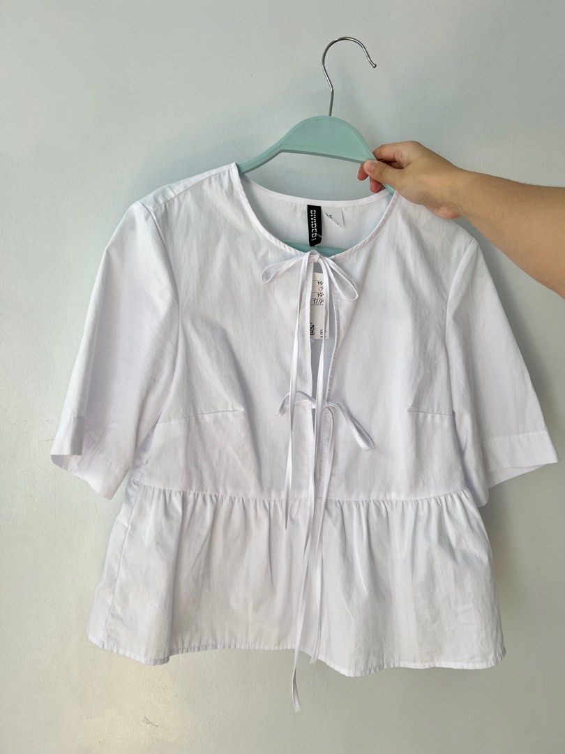 H&M Tie Tops (White and Black) (Category: Blouses) located in Tarlac. Submitted by lilipup (Listing ID 1324581499, Image 1). Description: brand new with tags 650 php each + shipping fee last price posted! size XS (fits XS-S) available in white and black got them from H&M online app popular GANNI dupe rfs: want them in another size.
