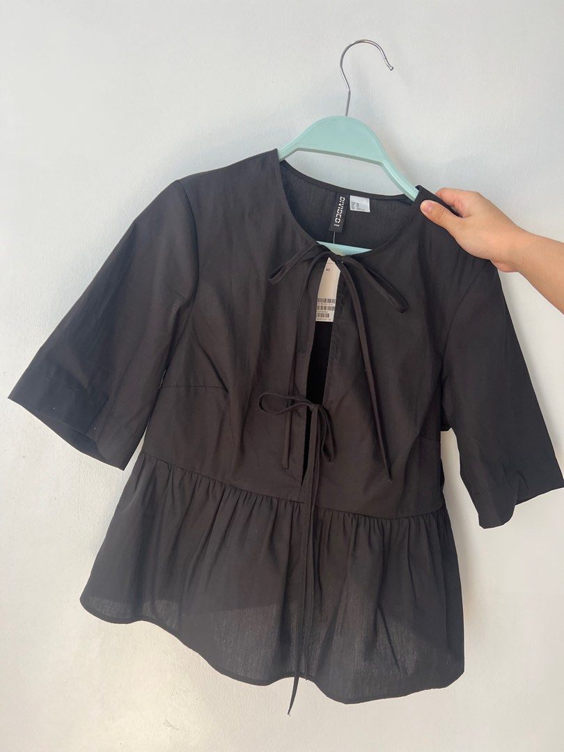 H&M Tie Tops (White and Black) (Category: Blouses) located in Tarlac. Submitted by lilipup (Listing ID 1324581499, Image 3). Description: brand new with tags 650 php each + shipping fee last price posted! size XS (fits XS-S) available in white and black got them from H&M online app popular GANNI dupe rfs: want them in another size.