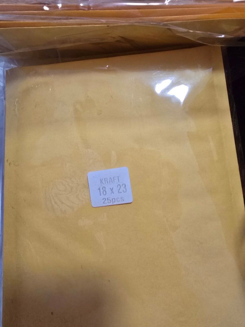 Packaging (Category: Everything Else) located in Singapore. Submitted by ssssyl (Listing ID 1344816675, Image 2). Description: Selling 82 paded orange packaging. giving the carton boxes and white packaging for free..
