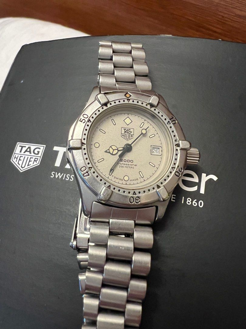 Tag Heuer (Category: Women's Watches) located in Las Pinas. Submitted by chubbychobs2012 (Listing ID 1344541981, Image 3). Description: Women’s 2000 series Stainless Steel Quartz movement 26mm case diameter With date feature 200 meters water resistance Grey face Double clasp security.