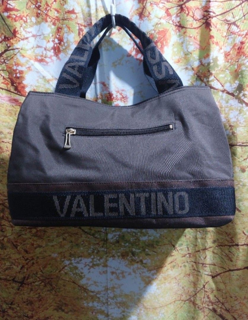 Valentino Bag (Category: Luxury Bags & Wallets) located in Muntinlupa City. Submitted by sakurambo_des (Listing ID 1344890124, Image 1). Description: Personal Preloved Auth.Valentino Wrist/Handbag Nylon Brown 3 compartment Like new condition..
