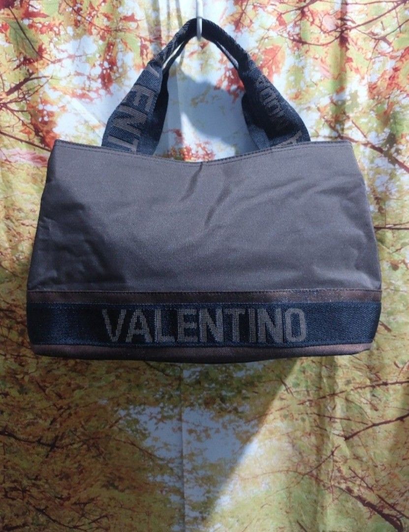 Valentino Bag (Category: Luxury Bags & Wallets) located in Muntinlupa City. Submitted by sakurambo_des (Listing ID 1344890124, Image 2). Description: Personal Preloved Auth.Valentino Wrist/Handbag Nylon Brown 3 compartment Like new condition..