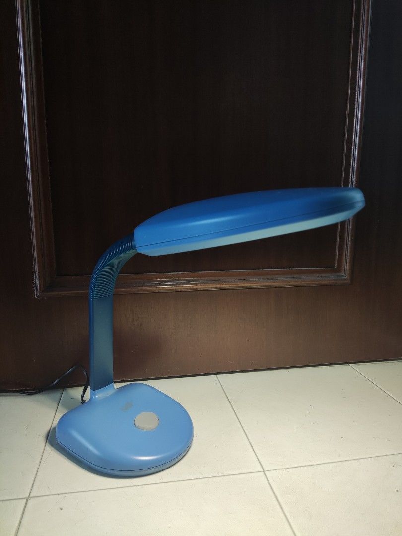 Adjustable Table Lamp (Category: Lighting) located in Singapore. Submitted by kevezi (Listing ID 1346779113, Image 1). Description: Well-lit and useful adjustable lamp. Previously used for night studying, now clearing up items! Conditions still good as shown in the photos. 2-pin power cord comes together. PM if interested! :).