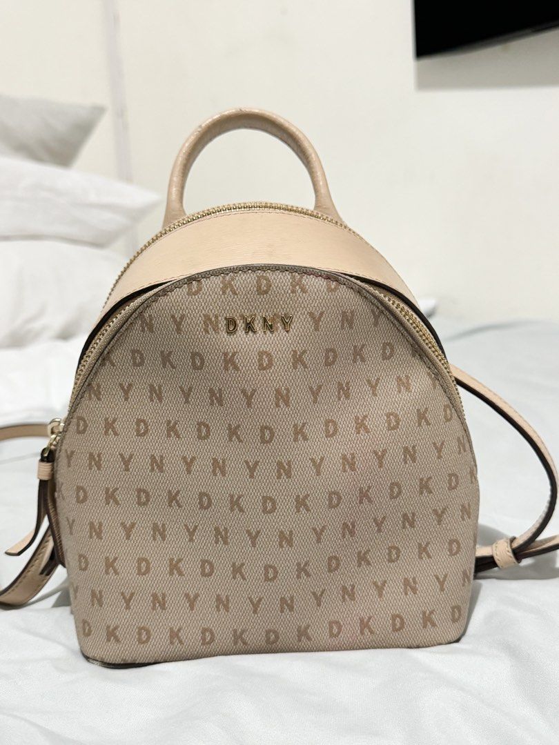 AUTHENTIC DKNY Sling/2 way bag (Category: Cross-body Bags) located in Manila. Submitted by jbsquared (Listing ID 1346814756, Image 1). Description: Authentic DKNY bag store bought from Malaysia 🇲🇾 still super nice when worn! No major flaws just signs of usage on the handle and liptint stain at the zipper area but inside is 100% clean Only flaw as well is it’s missing the other strap 😭😭 Since I don’t use it as a backpack and only use it as a s