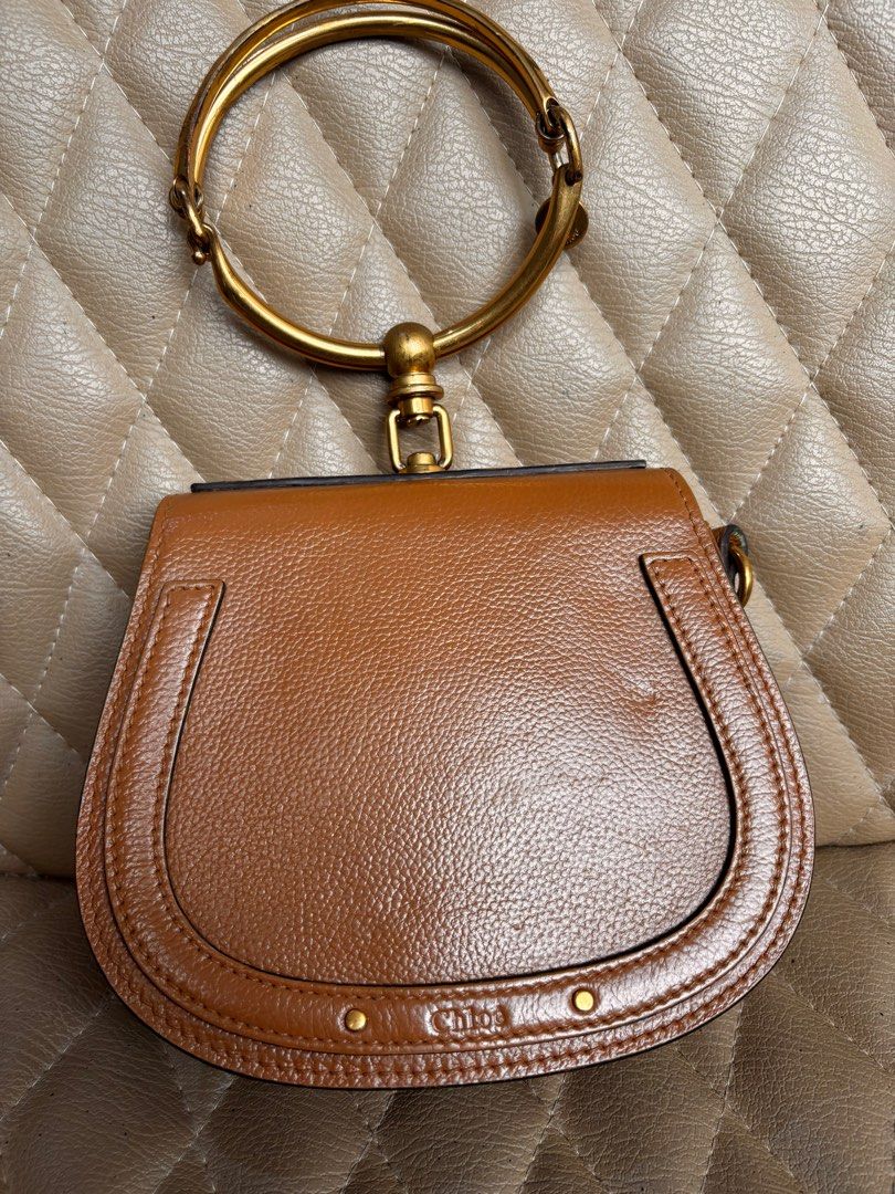 Chloe Bag Nile Bracelet Bag (Category: Luxury Bags & Wallets) located in Quezon City. Submitted by dmanille (Listing ID 1346754612, Image 2). Description: Authentic Chloe Bracelet Bag NIlE Cross body, bracelet bag With removable strap Fresh from bag spa Recolored from beige to light brown With a little dent infront due to storage With some stains inside the bag Perform own authentication procedure before purchase. .