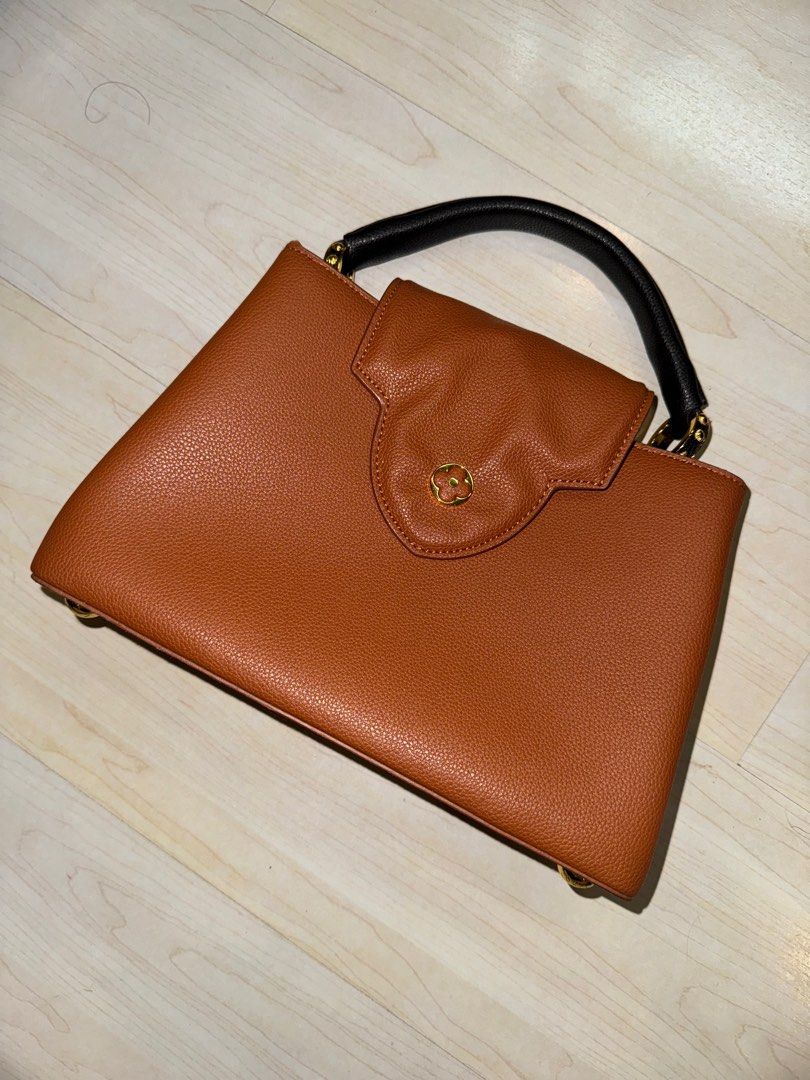 Louis Vuitton Capucines MM Bag (Tan) (Category: Luxury Bags & Wallets) located in Antipolo. Submitted by marian_ang (Listing ID 1346858251, Image 1). Description: - Missing long strap, therefore can be used as a handbag only - Minor defects (not very obvious) - Thick - Doesn’t include a bag cover - Hindi nagbabakbak !!.