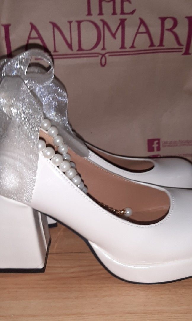 Coquette White Platform Heels (Category: Heels) located in Manila. Submitted by strawberryshortcakeeee (Listing ID 1346801125, Image 3). Description: 🎀 Bought and first used last December (2024) and worn again last August (2025). Comes with the box. Note: Has small, white clumps of foot powder (Milcu) inside. Bought for PhP 1,500. Please don't haggle..