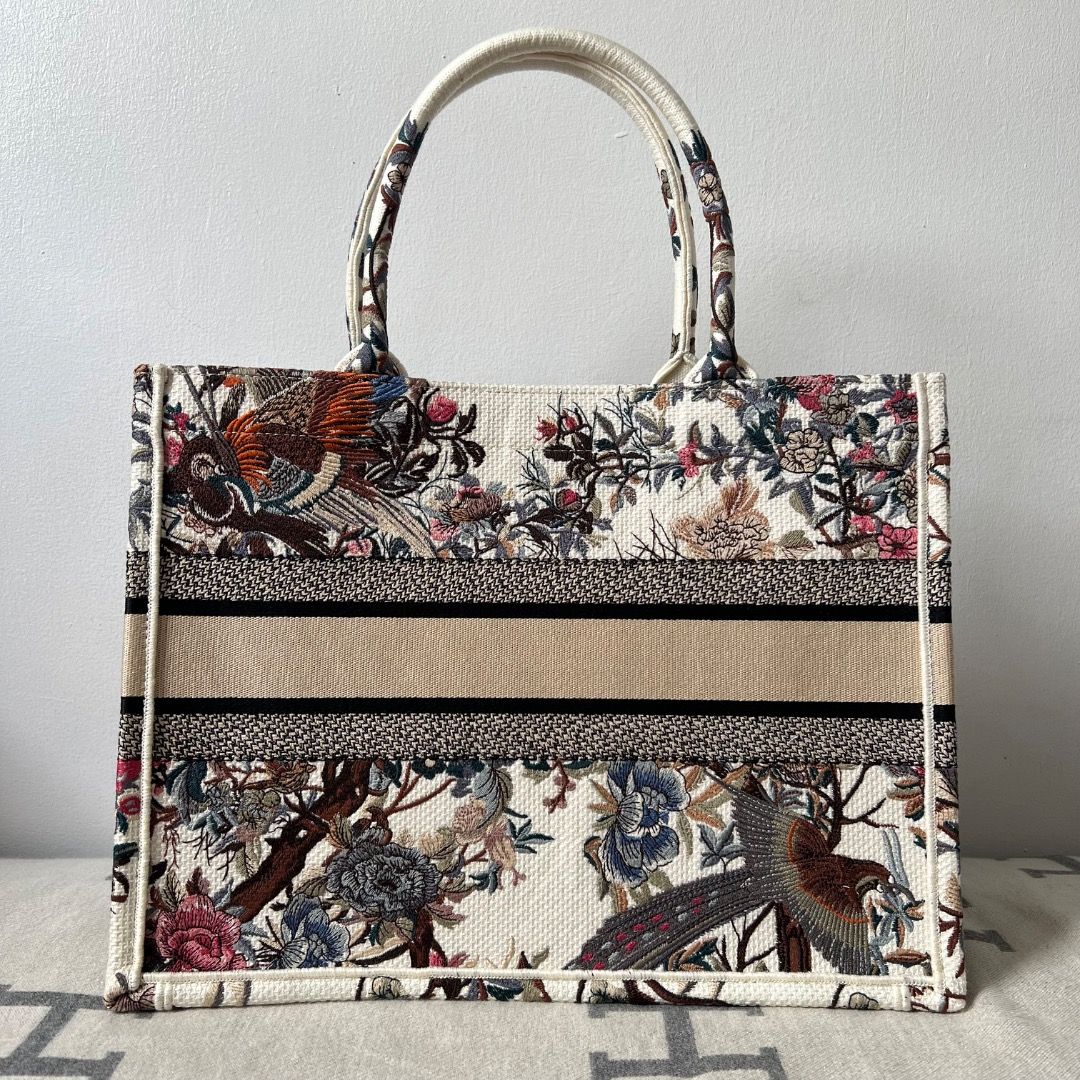 Dior Medium Book Tote Bag (Category: Luxury Bags & Wallets) located in Antipolo. Submitted by chanchimj (Listing ID 1325367736, Image 2). Description: The bag's large size can accommodate a 15-inch laptop, a pouch, a wallet, a phone, sunglasses and lipstick 14 x 11 x 6.5 inches Dust bag included.