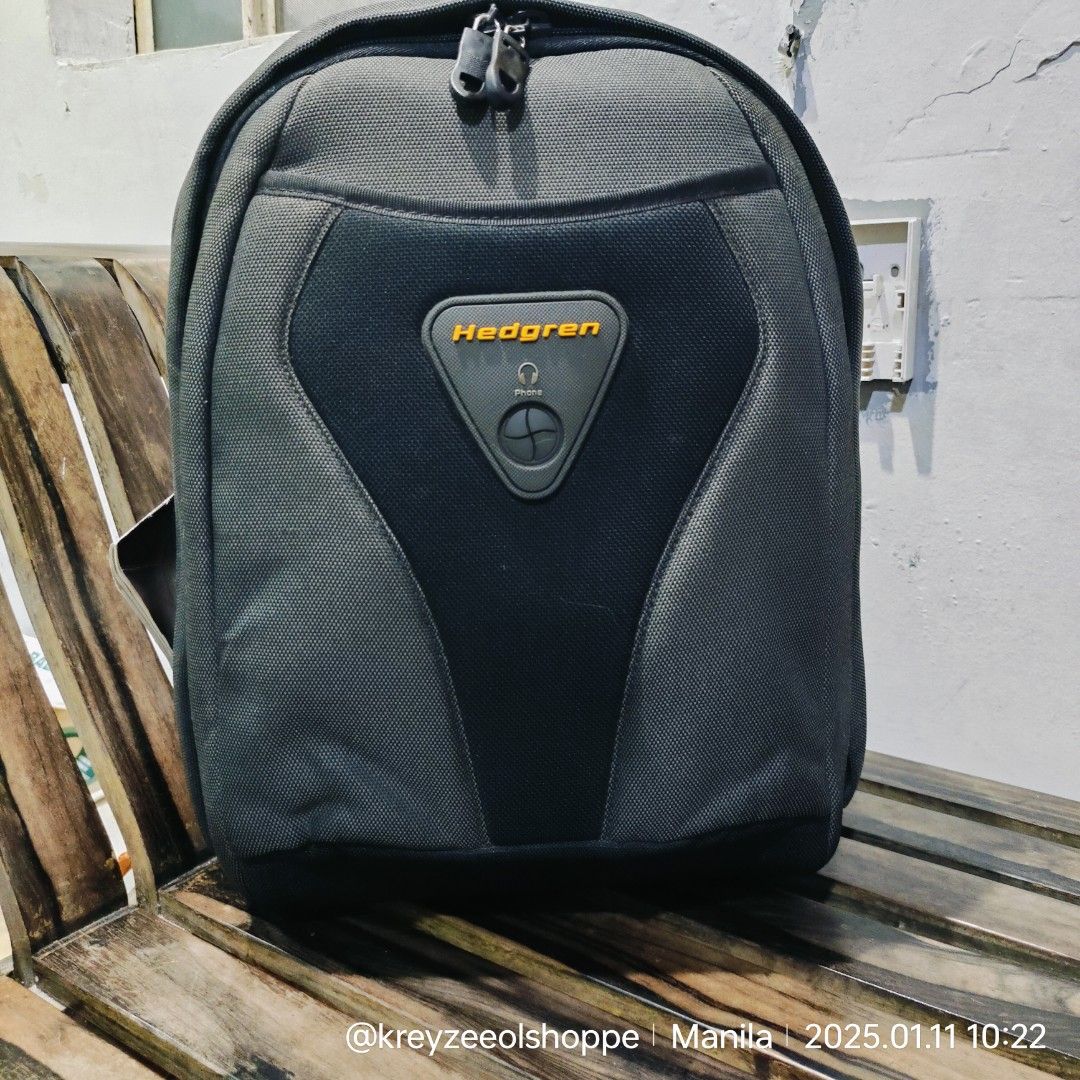 Hedgren Backpack (Category: Backpacks) located in Manila. Submitted by smiley_a (Listing ID 1346683772, Image 1). Description: Excellent condition with the exception of the zipper pulls already replaced. described below. Nylon and Neoprene Fitted firm shell on back side. Soft shell on front. Lots of compartments This is a smaller size bag. Approximate measurements: 14" Tall 11" wide 6" deep This will fit a small laptop or tablet approx 11" x 10" 