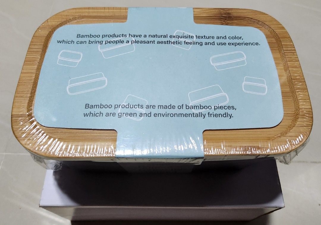Lunch box (Category: Everything Else) located in Singapore. Submitted by srayni (Listing ID 1346826310, Image 1). Description: 304 Stainless steel lunch box with bamboo lid + silicone. Capacity: 1300ml Color: Black Heat resistance in both high and low temperatures..