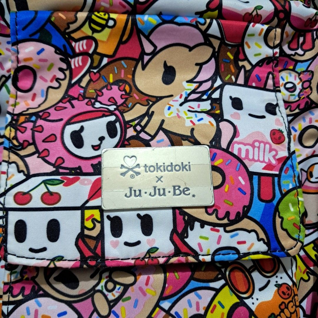Preloved Jujube MiniBe - Tokipops (Category: Diaper Bags & Wetbags) located in Pasig City. Submitted by mommaof3ph (Listing ID 1346836061, Image 3). Description: Preloved VGUC Jujube MiniBe Tokidoki Collection Tokipops Bag only - No Inclusion ✅️1st Owner ✅️Still Crisp ✅️Vibrant Color ✅️Original Plastic Packaging and tags included ❌️No Holes ❌️No Visible Damage Flaw/s: May faint penmark ng ballpen sa loob pero baka makuha sa laba and natanggal na 