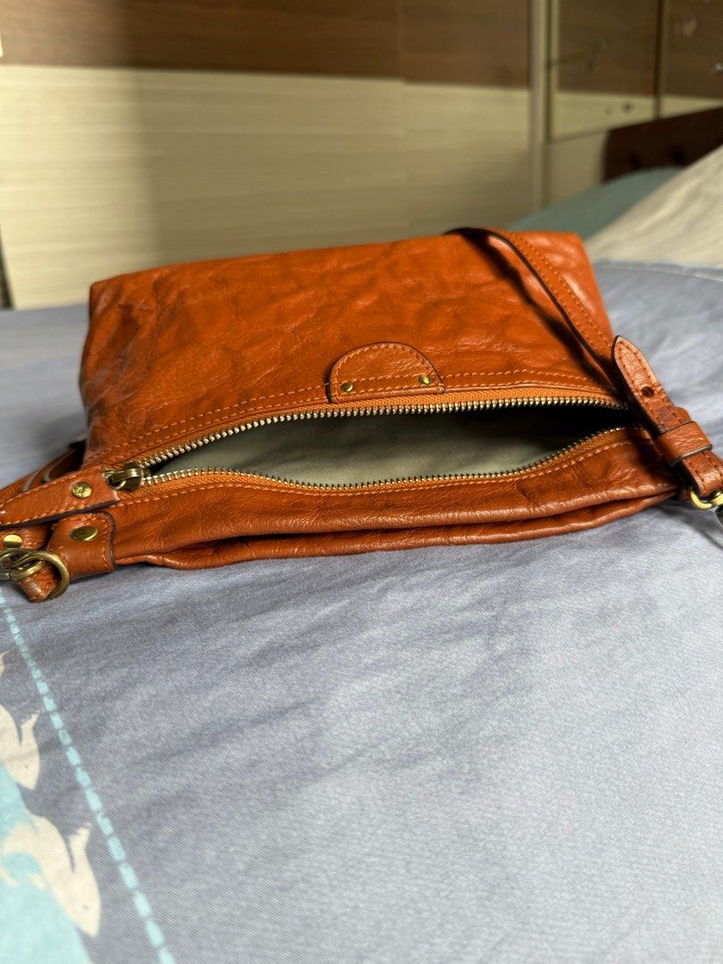 AUTHENTIC FINO Crinkled Sling bag (Category: Luxury Bags & Wallets) located in Taguig. Submitted by _annaq_ (Listing ID 1347016482, Image 2). Description: Comes with authentic FINO dust bag For everyone’s fairness and transparency, kindly read Seller's Policy first before making an offer 😊 1. Please make sure that the product description, condition, reservation terms, payment, and shipping policies meet your expectations. 2. Once an offer is mad