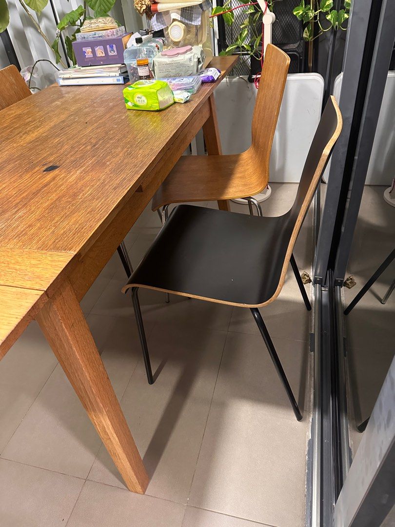 Extendable table set (Category: Tables & Sets) located in Singapore. Submitted by zhnzs520.1 (Listing ID 1347022521, Image 2). Description: Modern style extendable wooden table n chairs . 4 chairs together with the table Total length after extends 2m. Before extension is 1.2 meters wide 0.75M . .