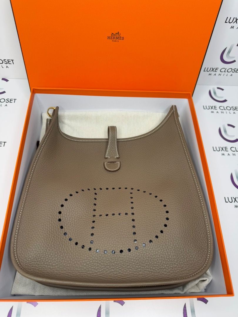 HERMES EVELYNE PM BRAND NEW (Category: Luxury Bags & Wallets) located in Las Pinas. Submitted by happystar_cac724 (Listing ID 1346962397, Image 1). Description: Brand New Hermes Evelyne Pm in Etoupe gold hardware Complete with dustbin, card, box, paperbag and a copy of the store receipt .