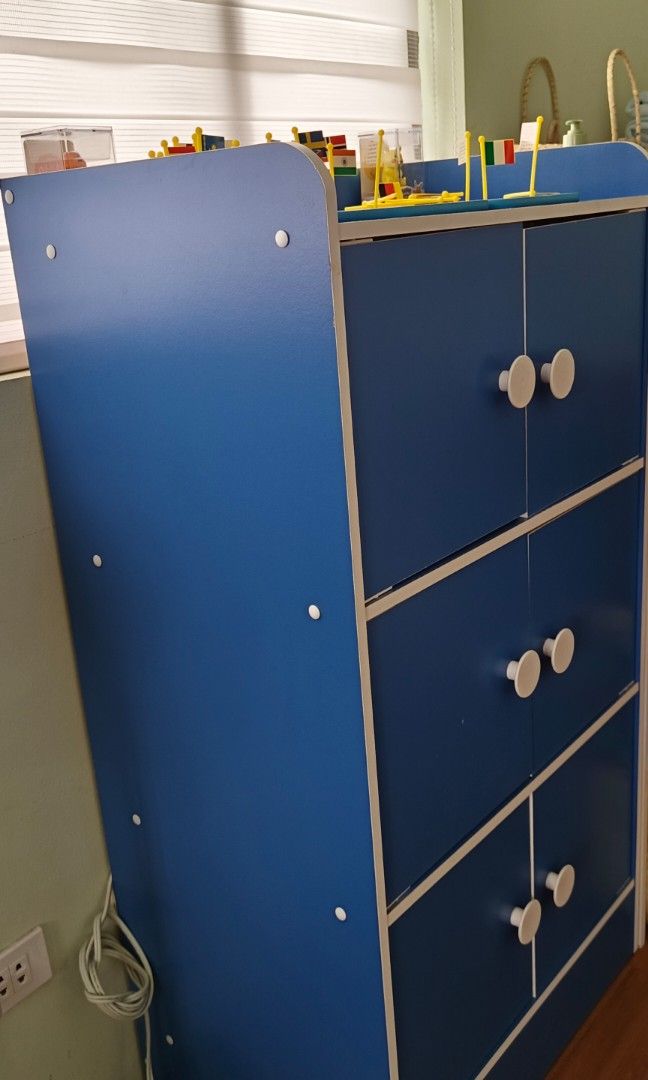 Kids Wardrobe Set (Cabinet + Side Table) (Category: Shelves, Cabinets & Racks) located in Quezon City. Submitted by f3foods (Listing ID 1346948828, Image 2). Description: Blue Boys Cabinet with Side Table (w/Drawer) Bought Brand New at Mandaue Store 3-layers Good as new With Blue Side Table with Drawer BEST FOR BOYS ROOM RFS: Change of my sons room decor.
