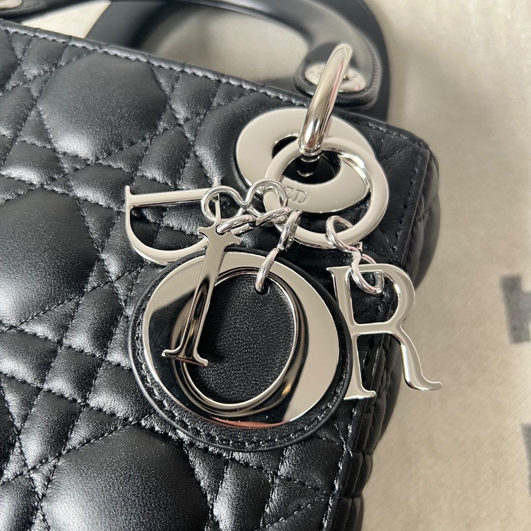 Mini Lady Dior Bag Black Cannage Lambskin (Category: Luxury Bags & Wallets) located in Antipolo. Submitted by chanchimj (Listing ID 1338798780, Image 2). Description: Featuring a removable chain shoulder strap, the miniature Lady Dior bag can be carried by hand or worn crossbody as an ideal evening wear companion. 17 x 15 x 7 cm.