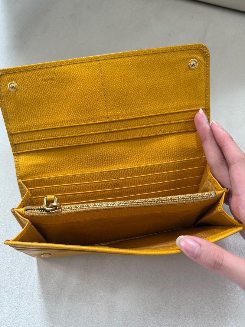 Prada Wallet (Category: Luxury Bags & Wallets) located in Quezon City. Submitted by ak3isha (Listing ID 1346921049, Image 3). Description: Color: Yellow *signs of usage are visible.