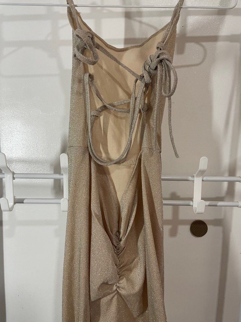 Sparkly Tieback Champagne Long Backless Dress (Category: Dresses) located in Batangas. Submitted by p.dmnl (Listing ID 1346901026, Image 2). Description: - when worn pics on the last 2 slides (on size XS) - no stains - has a few runs on the back strings - length: 48.5 inches - fits XS-Semi-medium.