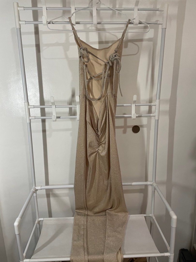 Sparkly Tieback Champagne Long Backless Dress (Category: Dresses) located in Batangas. Submitted by p.dmnl (Listing ID 1346901026, Image 3). Description: - when worn pics on the last 2 slides (on size XS) - no stains - has a few runs on the back strings - length: 48.5 inches - fits XS-Semi-medium.