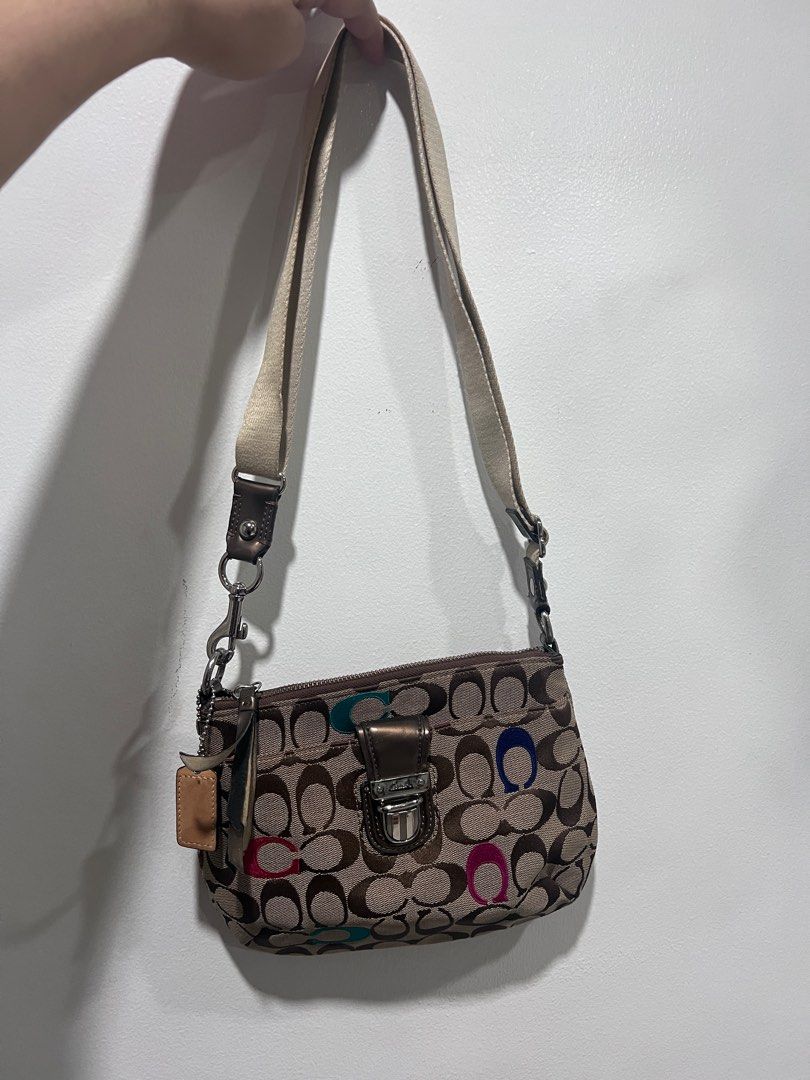 Coach Two-Way Bag (Category: Luxury Bags & Wallets) located in Pasig City. Submitted by declutterwithai (Listing ID 1347216868, Image 3). Description: ♦️Original ♦️Two way sling & shoulder bag ♦️Bought in Japan ♦️Personal Use (First owner) ♦️Removable Strap, with 1 inside pocket ♦️9/10 - with minimal stain inside the bag, signs of use & needs cleaning only ♦️Zipper strap needs to glue back only — does not affect performance ♦️Inclusion- bag as is