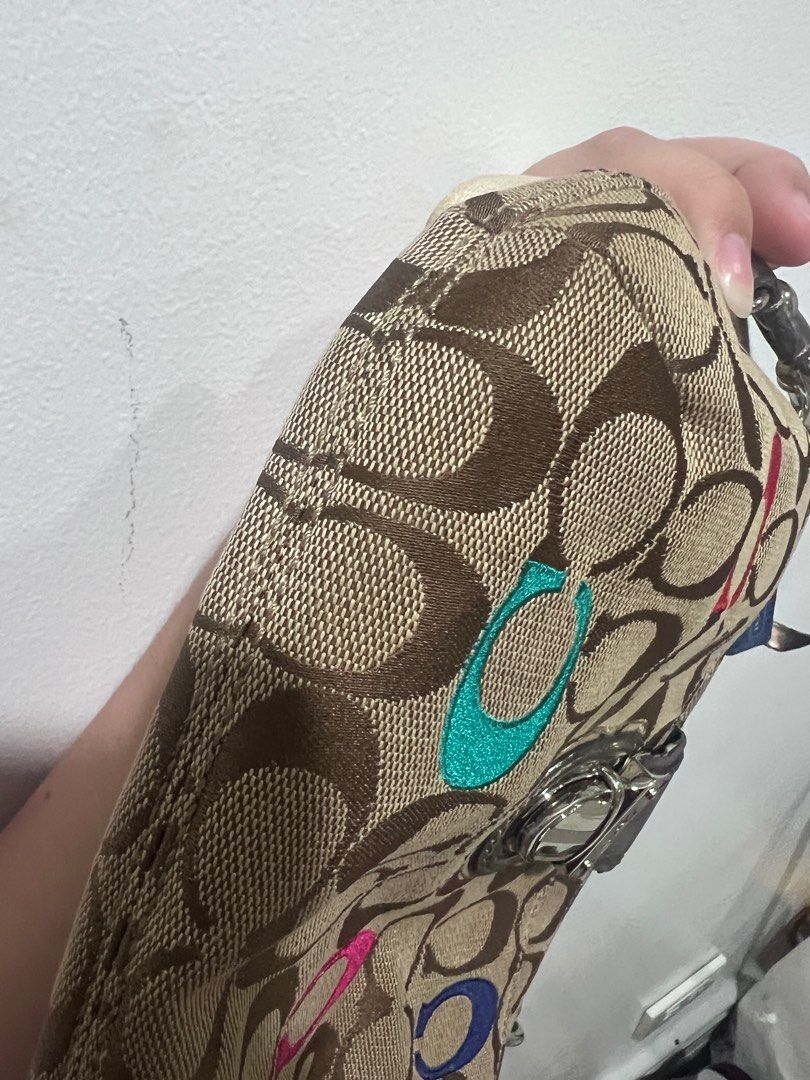 Coach Two-Way Bag (Category: Luxury Bags & Wallets) located in Pasig City. Submitted by declutterwithai (Listing ID 1347216868, Image 2). Description: ♦️Original ♦️Two way sling & shoulder bag ♦️Bought in Japan ♦️Personal Use (First owner) ♦️Removable Strap, with 1 inside pocket ♦️9/10 - with minimal stain inside the bag, signs of use & needs cleaning only ♦️Zipper strap needs to glue back only — does not affect performance ♦️Inclusion- bag as is