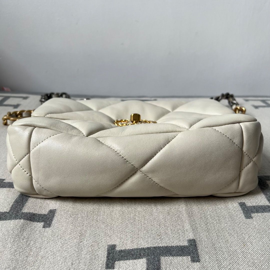 Chanel 19 Small off-white Quilted Chain Bag (Category: Luxury Bags & Wallets) located in Antipolo. Submitted by chanchimj (Listing ID 1335905556, Image 3). Description: Material: Calfskin Leather RANK B Condition This item has been used and may have some minor flaws. Before purchasing, please refer to the images for the exact condition of the item. Kindly message us for the additional detailed photos. Thank you! 🔹No inclusions since this is prel