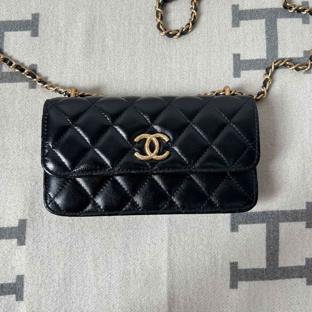 Chanel Flap Black Phone Sling Bag (Category: Luxury Bags & Wallets) located in Antipolo. Submitted by chanchimj (Listing ID 1328048172, Image 1). Description: Dimension: 6.7” x 3.8” x 1” Comes with dust bag and cards.