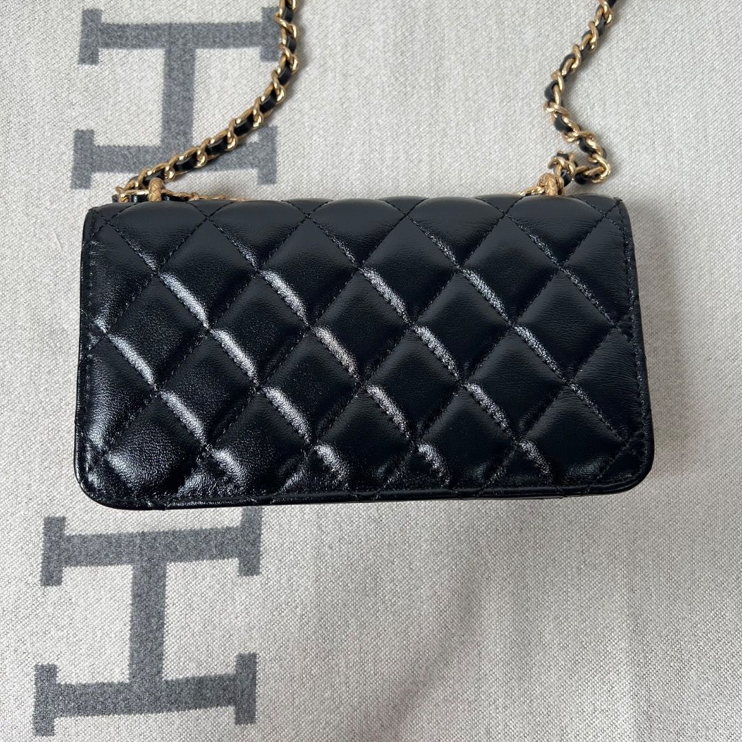 Chanel Flap Black Phone Sling Bag (Category: Luxury Bags & Wallets) located in Antipolo. Submitted by chanchimj (Listing ID 1328048172, Image 2). Description: Dimension: 6.7” x 3.8” x 1” Comes with dust bag and cards.