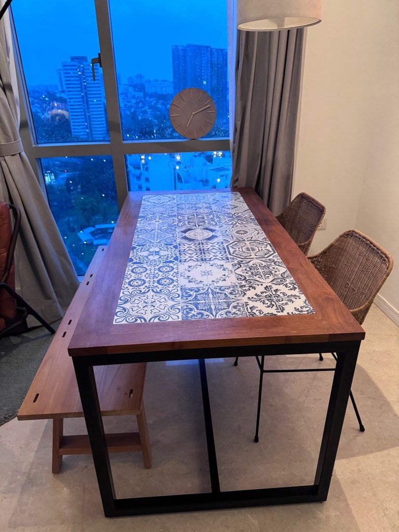 Dining Table (Category: Tables & Sets) located in Singapore. Submitted by nikhilk218 (Listing ID 1347416619, Image 2). Description: Unique dining table with solid teak top, ceramic design, and sturdy iron legs. Can be a 6 or 4 seater 160cm length x 75cm height x 80cm width.