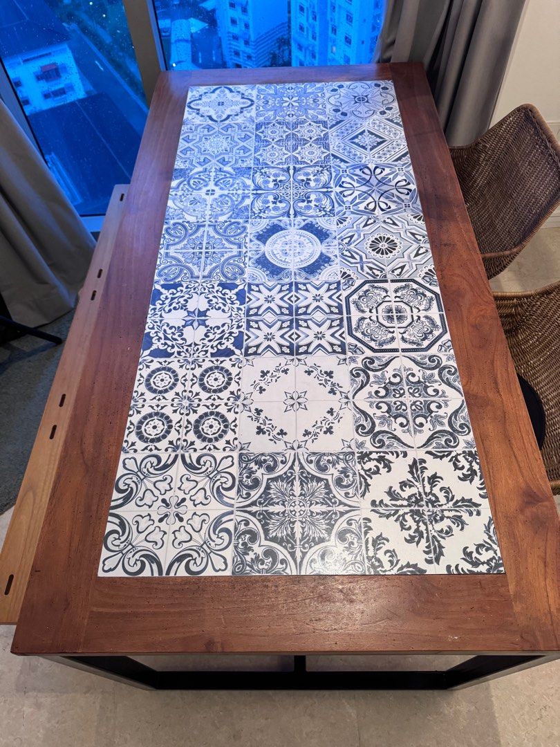 Dining Table (Category: Tables & Sets) located in Singapore. Submitted by nikhilk218 (Listing ID 1347416619, Image 1). Description: Unique dining table with solid teak top, ceramic design, and sturdy iron legs. Can be a 6 or 4 seater 160cm length x 75cm height x 80cm width.