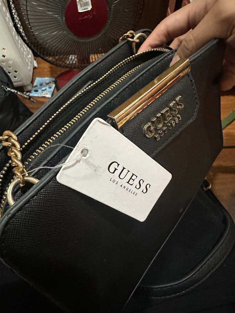 Guess body bag (Category: Cross-body Bags) located in Pasay City. Submitted by dunkinn (Listing ID 1347323552, Image 3). Description: ♥️ used only once ♥️natambak lang never na nagalit. Forgot i have this ♥️decluttering ♥️for a cause.