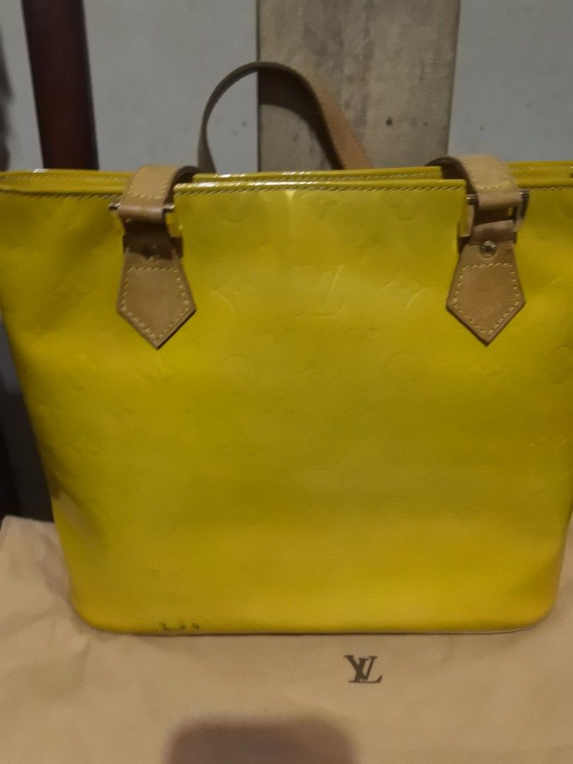 LV Vernis Tote bag with dustbag (Category: Luxury Bags & Wallets) located in Quezon City. Submitted by uptrendglam (Listing ID 1347362951, Image 3). Description: LV Vernis Tote bag with dustbag. Zipper closure. Clean Interior with discoloration on the patent leather(see photos for ready reference). Will be providing you with the picture of the bag's serial no if interested. Guaranteed authentic both bag and dustbag..
