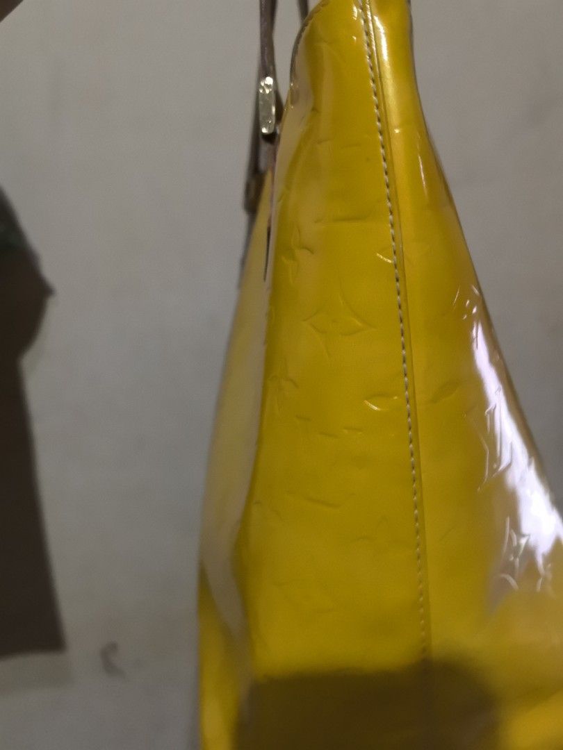 LV Vernis Tote bag with dustbag (Category: Luxury Bags & Wallets) located in Quezon City. Submitted by uptrendglam (Listing ID 1347362951, Image 2). Description: LV Vernis Tote bag with dustbag. Zipper closure. Clean Interior with discoloration on the patent leather(see photos for ready reference). Will be providing you with the picture of the bag's serial no if interested. Guaranteed authentic both bag and dustbag..