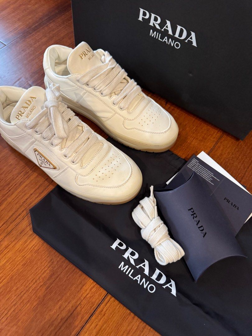 PRADA Downtown nappa leather sneakers (Category: Sneakers & Footwear) located in Muntinlupa City. Submitted by bagstagram (Listing ID 1347378605, Image 3). Description: PRADA Downtown nappa leather sneakers Highlights: ivory white calf leather smooth grain front lace-up fastening branded heel counter raised logo detail logo-print tongue enamel triangle logo perforated toebox almond toe branded insole rubber sole Reason for selling: decluttering C