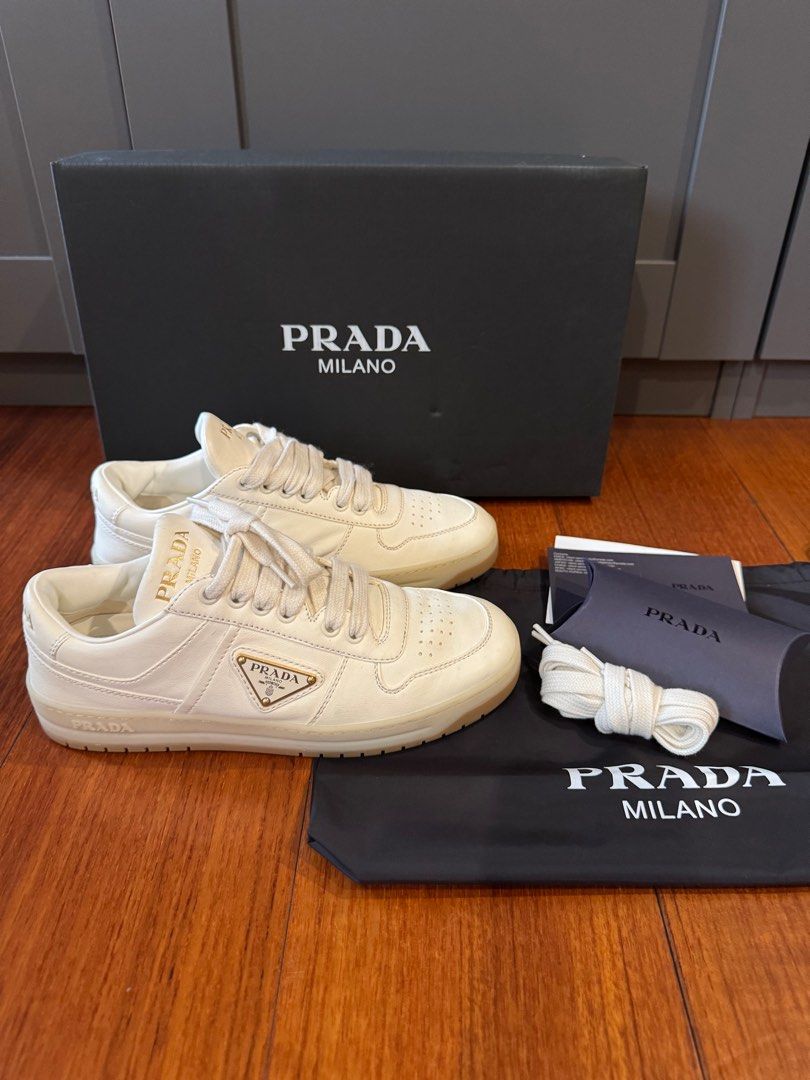 PRADA Downtown nappa leather sneakers (Category: Sneakers & Footwear) located in Muntinlupa City. Submitted by bagstagram (Listing ID 1347378605, Image 1). Description: PRADA Downtown nappa leather sneakers Highlights: ivory white calf leather smooth grain front lace-up fastening branded heel counter raised logo detail logo-print tongue enamel triangle logo perforated toebox almond toe branded insole rubber sole Reason for selling: decluttering C
