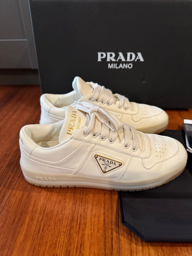 PRADA Downtown nappa leather sneakers (Category: Sneakers & Footwear) located in Muntinlupa City. Submitted by bagstagram (Listing ID 1347378605, Image 2). Description: PRADA Downtown nappa leather sneakers Highlights: ivory white calf leather smooth grain front lace-up fastening branded heel counter raised logo detail logo-print tongue enamel triangle logo perforated toebox almond toe branded insole rubber sole Reason for selling: decluttering C